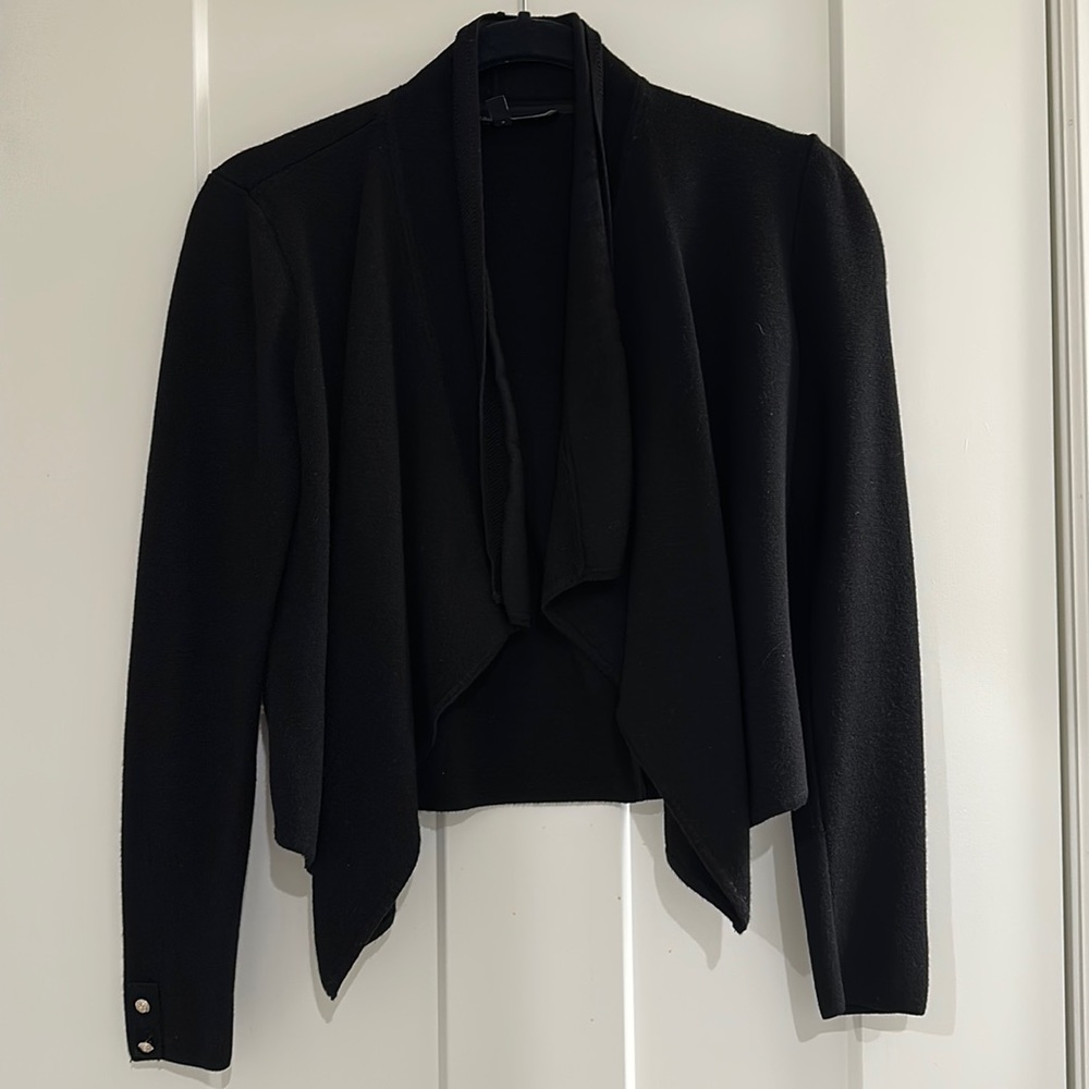 Super cute short black open front cardigan to dress up or down!